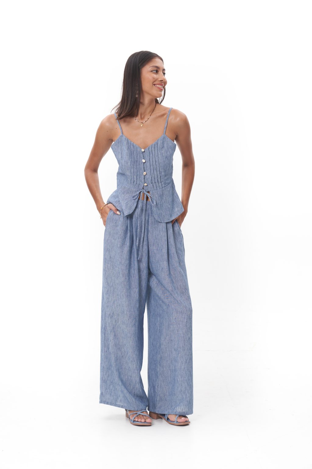 Luma Top Softly structured and effortlessly feminine, the Luma Top features a delicate tie-front closure and a gently flared peplum silhouette. Crafted in an airy, lightweight fabric, it offers ease and movement while maintaining a refined, minimalist feel. Designed to be worn on its own or paired seamlessly with the Luma Pant for an elevated, coordinated look.