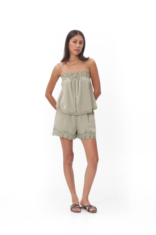 Olivia Lace Camisole Top The Olivia Lace Camisole Top embodies soft femininity with an effortless sense of luxury, crafted from a lightweight, fluid fabric that drapes beautifully against the body. Delicate lace trim frames the neckline, adding a romantic touch, while slender adjustable straps create a graceful, refined silhouette. Designed to feel intimate yet polished, this piece moves seamlessly from relaxed moments to elevated styling, whether worn alone or layered for a sophisticated day-to-night look.