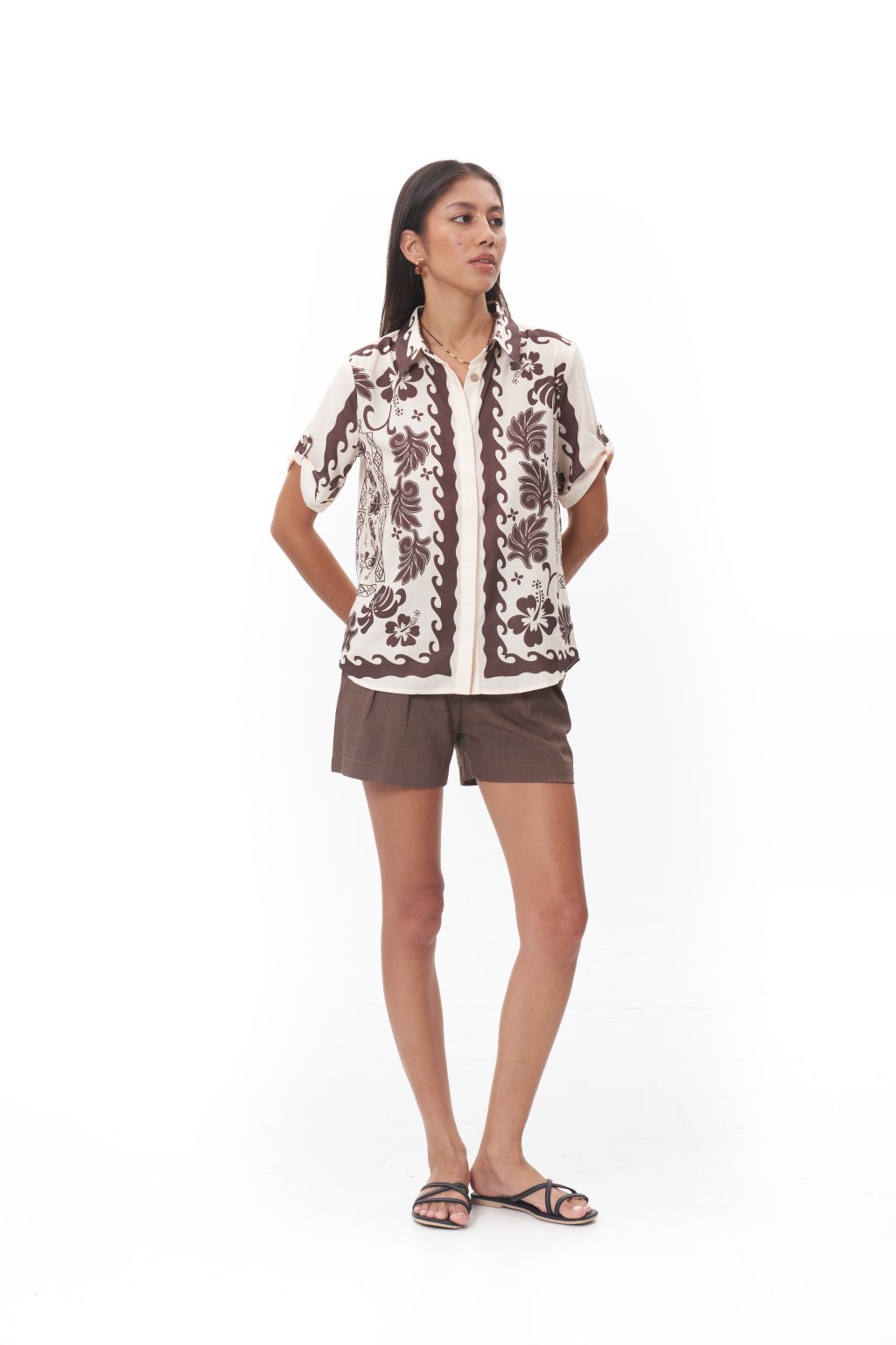 The Sorella Printed Top features a relaxed short-sleeve silhouette with a classic button-down front, finished with a soft floral-inspired print. Designed in a lightweight and breathable fabric, this piece offers effortless comfort and ease. It is the perfect top for warm afternoons, casual outings, or laid-back resort days