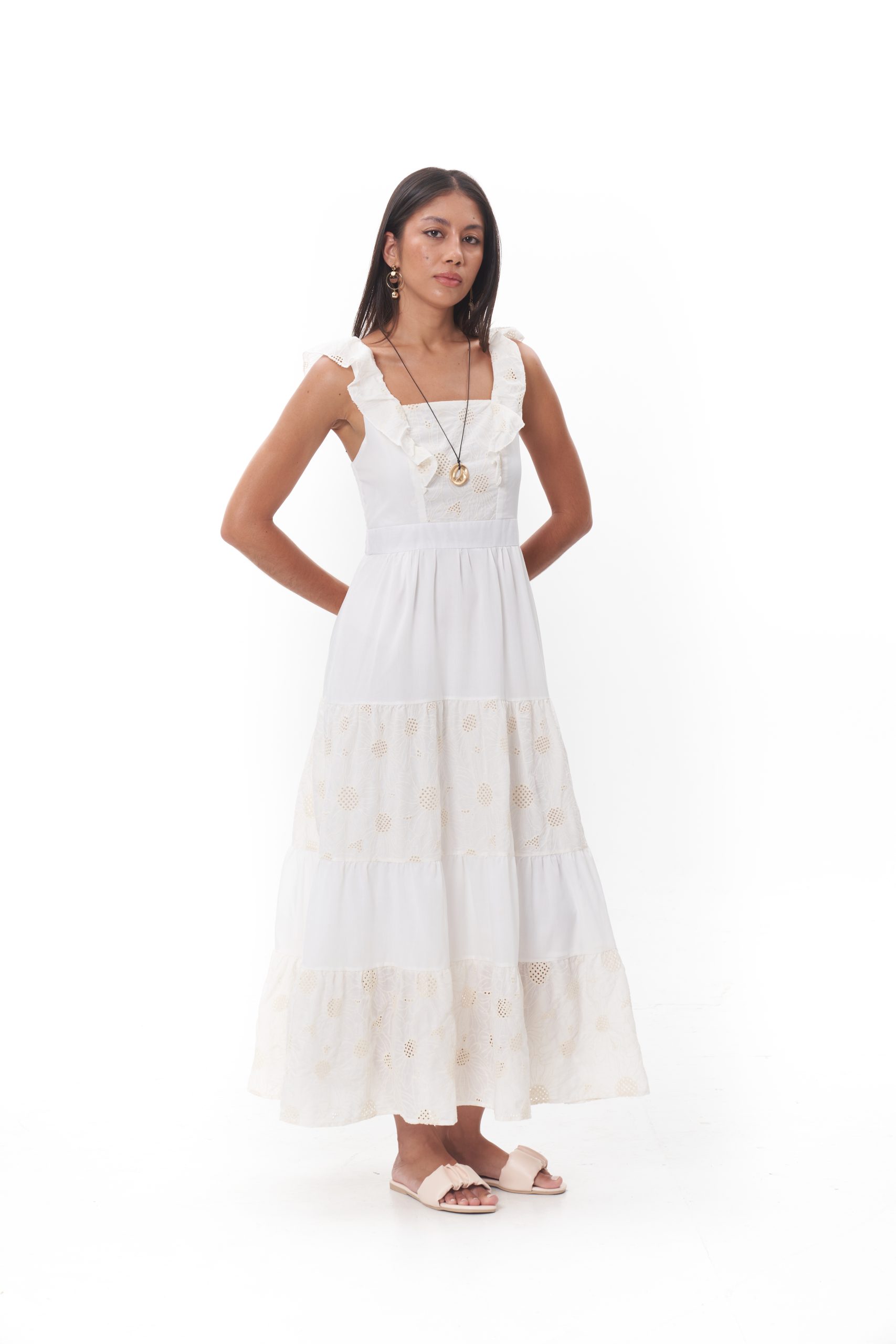 The Selene Tiered Maxi Dress features soft ruffled straps and a flattering square neckline, balanced by delicate lace panels throughout the skirt. Designed with a gently fitted bodice and a flowing tiered silhouette, it’s crafted in a lightweight, breathable fabric for effortless comfort. Perfect for relaxed days, garden gatherings, or warm-weather escapes.
