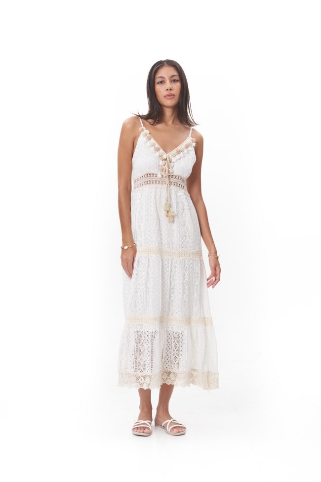 Rhea Lace Midi Dress features delicate spaghetti straps with a flattering V-neckline, finished with subtle tassel detailing for a romantic touch. Designed with a softly fitted bodice and a gently flowing skirt, it moves effortlessly with every step. Crafted in a breathable lace fabric and fully lined for comfort, this dress is perfect for sunlit strolls, garden gatherings, or seaside afternoons.
