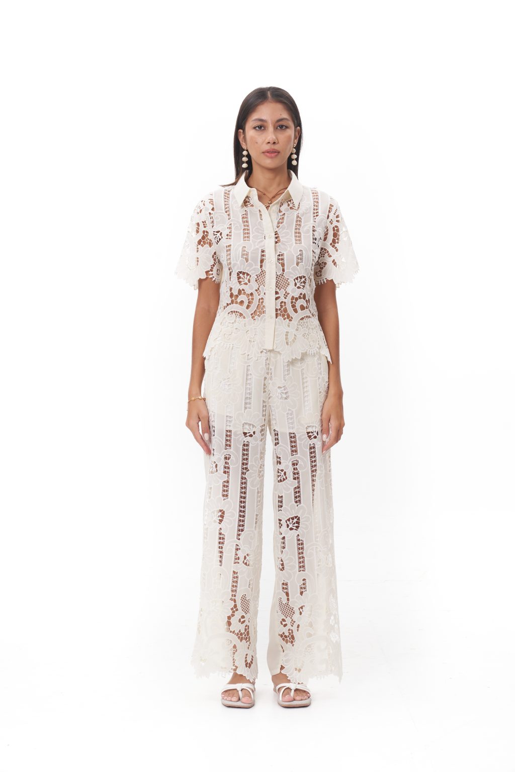 Maribel Lace Pants The Maribel Lace Pants are designed with a relaxed wide-leg silhouette that flows effortlessly. Made from intricate floral lace with a soft lining for comfort, they create an elegant balance of structure and ease. Ideal for resort occasions, summer gatherings, or pairing with the Maribel Lace Top for a coordinated statement.