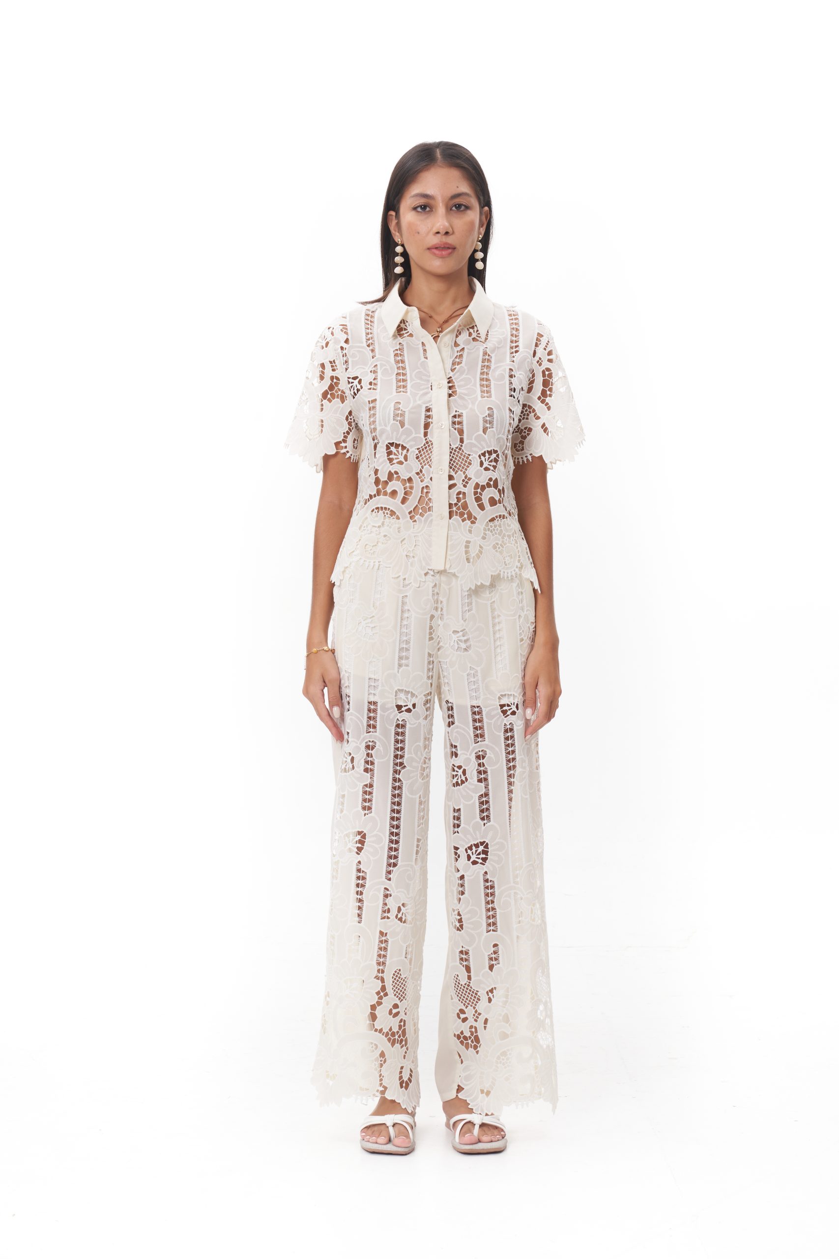 Maribel Lace Pants The Maribel Lace Pants are designed with a relaxed wide-leg silhouette that flows effortlessly. Made from intricate floral lace with a soft lining for comfort, they create an elegant balance of structure and ease. Ideal for resort occasions, summer gatherings, or pairing with the Maribel Lace Top for a coordinated statement.