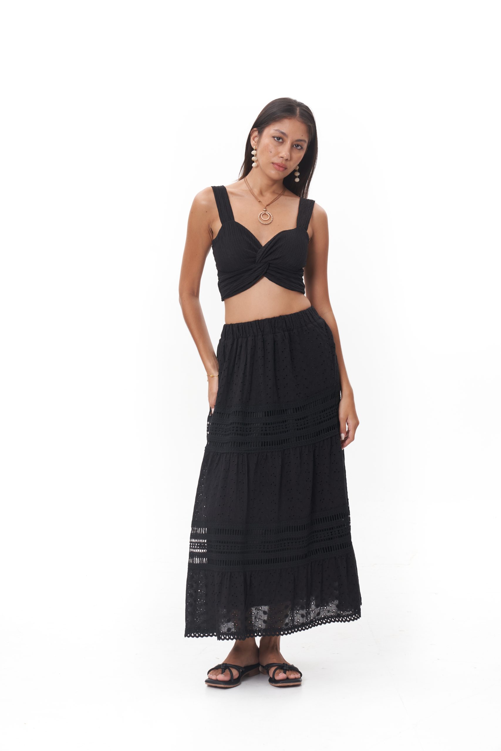 Bella Skirt The Bella Skirt is designed with a comfortable elastic waistband and a flowing midi-length silhouette. Crafted in a breathable eyelet fabric with subtle tiered detailing, it moves effortlessly while maintaining an elegant shape. Finished with delicate trim at the hem, this skirt pairs beautifully with the Nova Jade Top or stands out on its own for elevated everyday wear.
