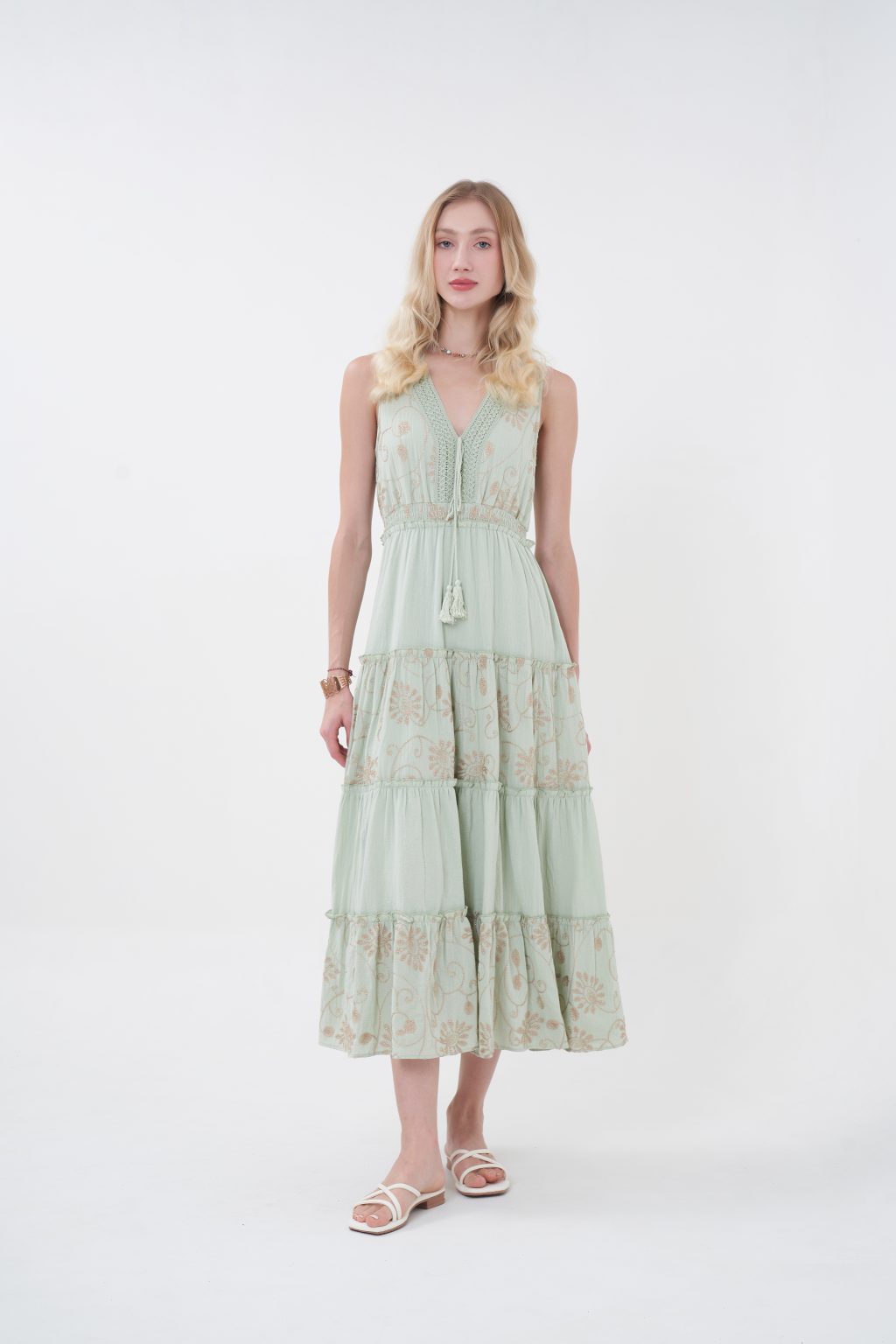 The Amelie Maxi Dress offers a romantic charm with a flowing full-length silhouette, featuring a flattering V-neckline, delicate straps, and intricate floral embroidery throughout. Designed with a softly cinched waist and tiered skirt for graceful movement, it provides an elegant, airy feel with a covered back. Perfect for effortless day-to-evening wear.