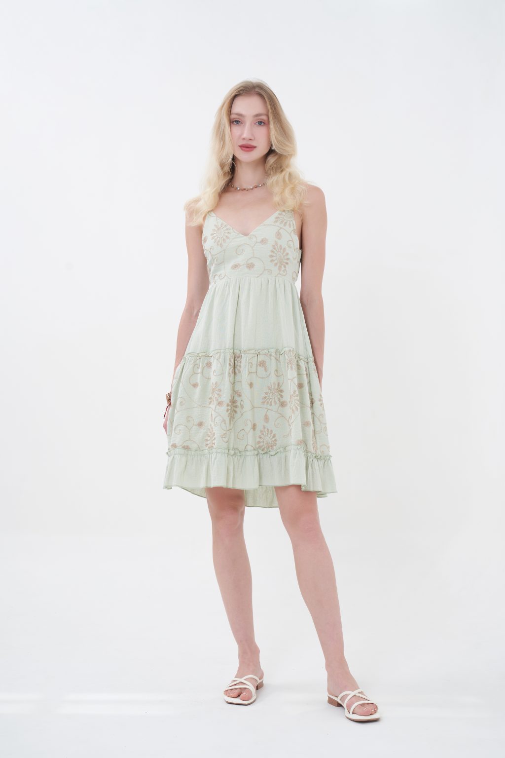 The Aurelie Mini Dress is a romantic, feminine style featuring a flattering V-neckline, delicate straps, and intricate floral embroidery across the bodice and skirt. Designed with a softly gathered waist and a flowy midi-length silhouette, it’s finished with an elegant open back and statement bow for a charming touch—perfect for warm days and special occasions.