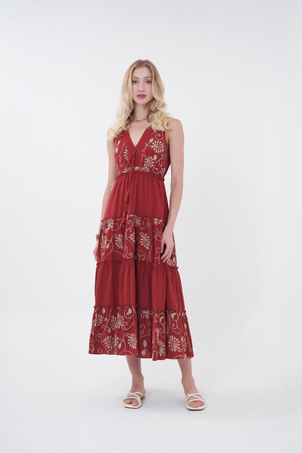 The Amelie Maxi Dress offers a romantic charm with a flowing full-length silhouette, featuring a flattering V-neckline, delicate straps, and intricate floral embroidery throughout. Designed with a softly cinched waist and tiered skirt for graceful movement, it provides an elegant, airy feel with a covered back. Perfect for effortless day-to-evening wear.