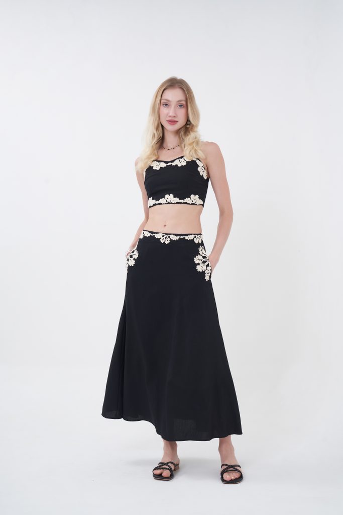 The Liora Skirt brings graceful movement and understated detail to your wardrobe. Cut in a flattering mid-length silhouette, it drapes beautifully with every step, while soft lace accents at the waist and pockets add a touch of femininity without overwhelming the design. Lightweight and effortlessly chic, it’s made for slow days, sunset dinners, and everything in between—just slip it on and let the look speak for itself.