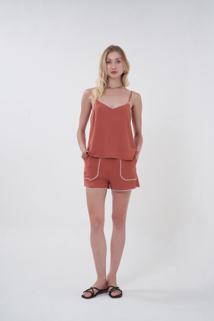 An easy, throw-on piece that still feels special, the Solea Camisole is designed with a soft, fluid drape that skims the body without clinging. The delicate contrast trim along the neckline adds just enough detail to stand out, giving it that subtle handcrafted vibe. Lightweight and breathable, it’s the kind of top you’ll reach for on repeat—effortless on its own, even better as a set.