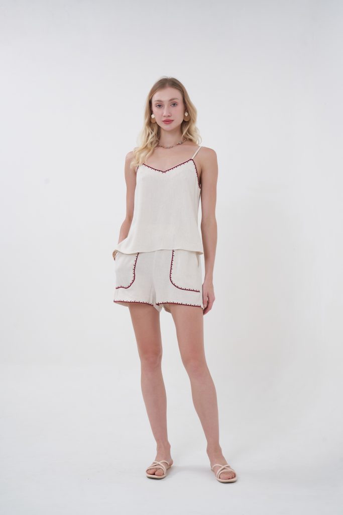 An easy, throw-on piece that still feels special, the Solea Camisole is designed with a soft, fluid drape that skims the body without clinging. The delicate contrast trim along the neckline adds just enough detail to stand out, giving it that subtle handcrafted vibe. Lightweight and breathable, it’s the kind of top you’ll reach for on repeat—effortless on its own, even better as a set.